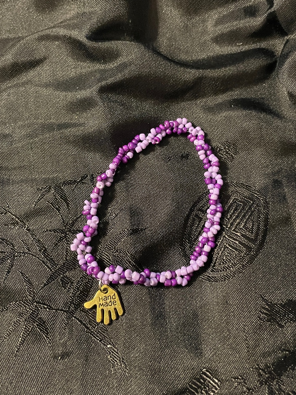 Handmade Purple Beaded Bracelet with Gold Hand Charm